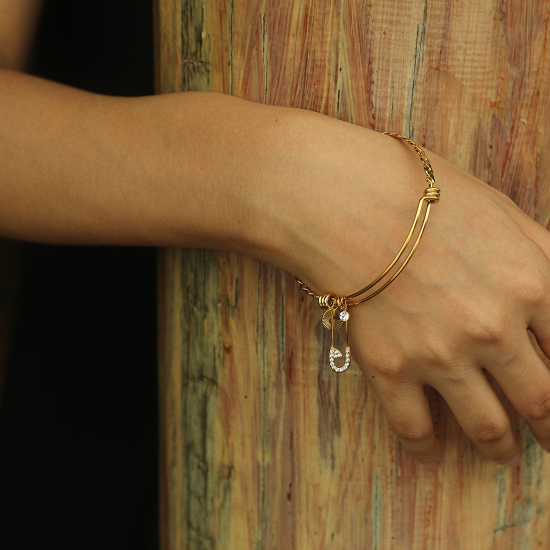 CHRISTINA: Charms Adorned Gold Bracelet