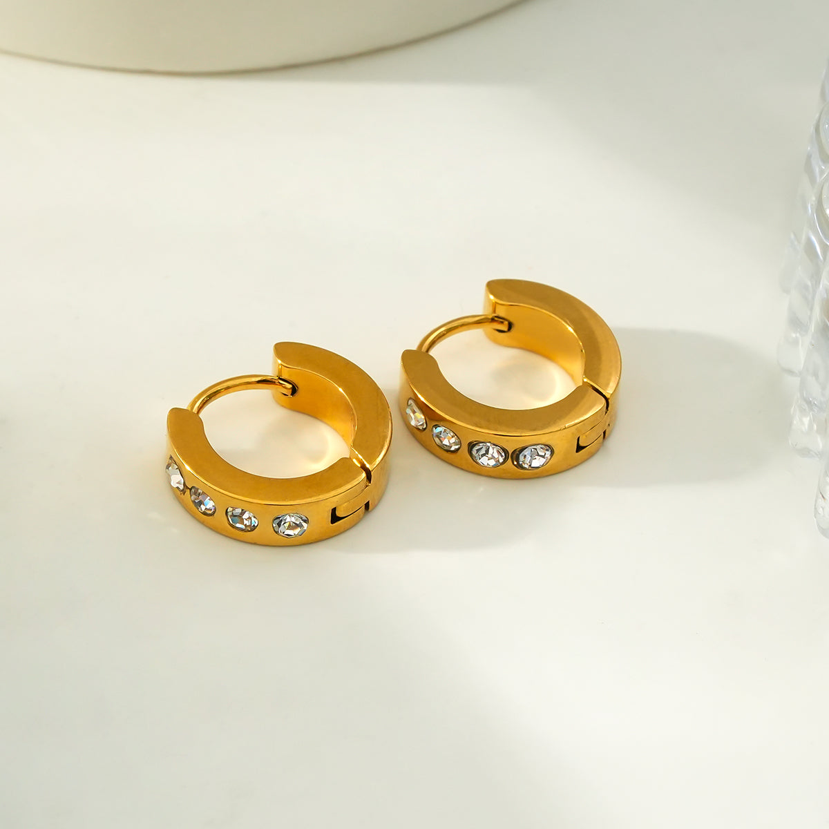 PAIA Gold: Wide Mini Hoop Earrings with an Array of Zirconia (CZ) Gemstones