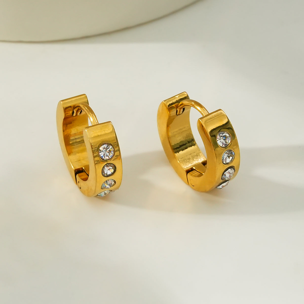 PAIA Gold: Wide Mini Hoop Earrings with an Array of Zirconia (CZ) Gemstones