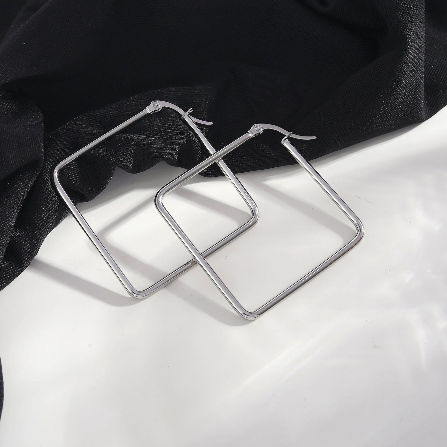 REILYNN: Square Silver Hoops - A Bold Twist on Classic Elegance