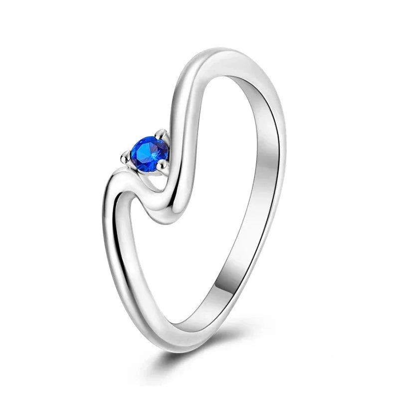 Flowing Wave Sterling Silver Ring with Blue Stone