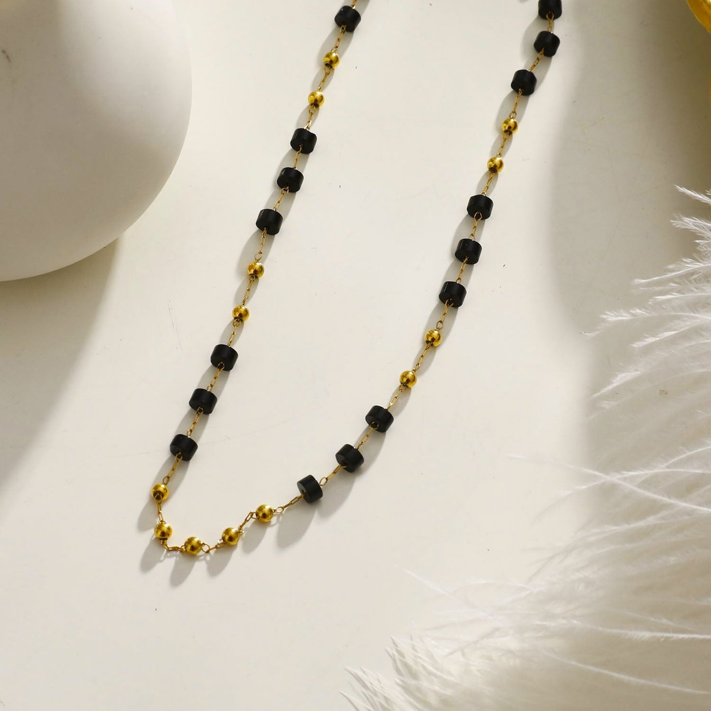 SANTA CRUZ Black: Gold & Black Onyx Beaded Chain Necklace