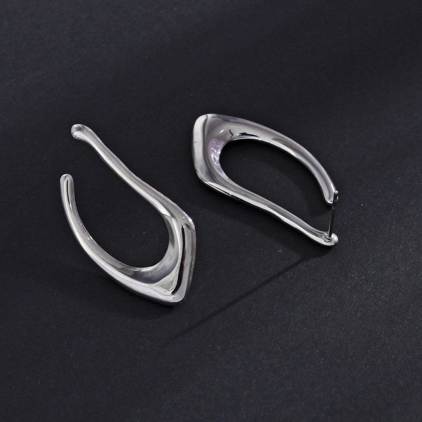 TARAJI Abstract Shaped Hoop Earrings in Silver