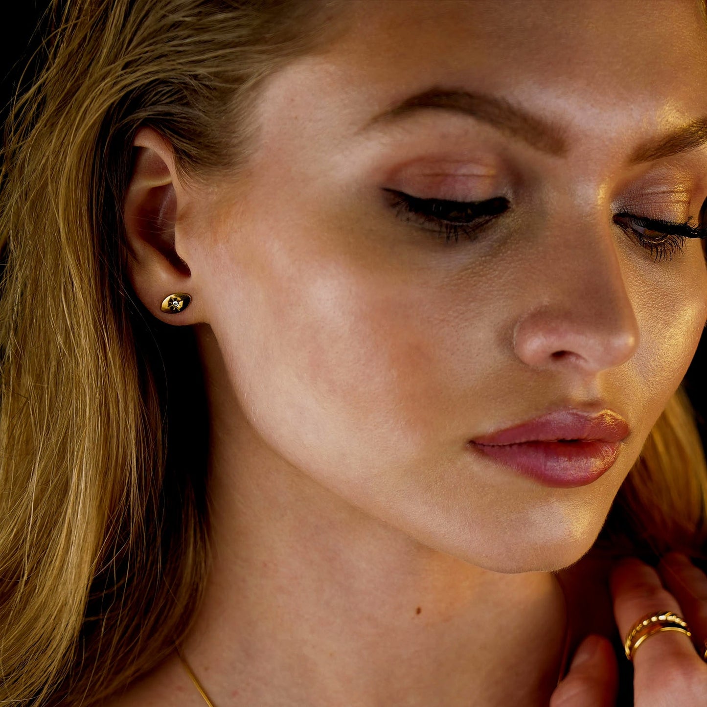 TINDRA: Oval Shaped Gold Stud Earrings Featuring a Solitaire Zirconia